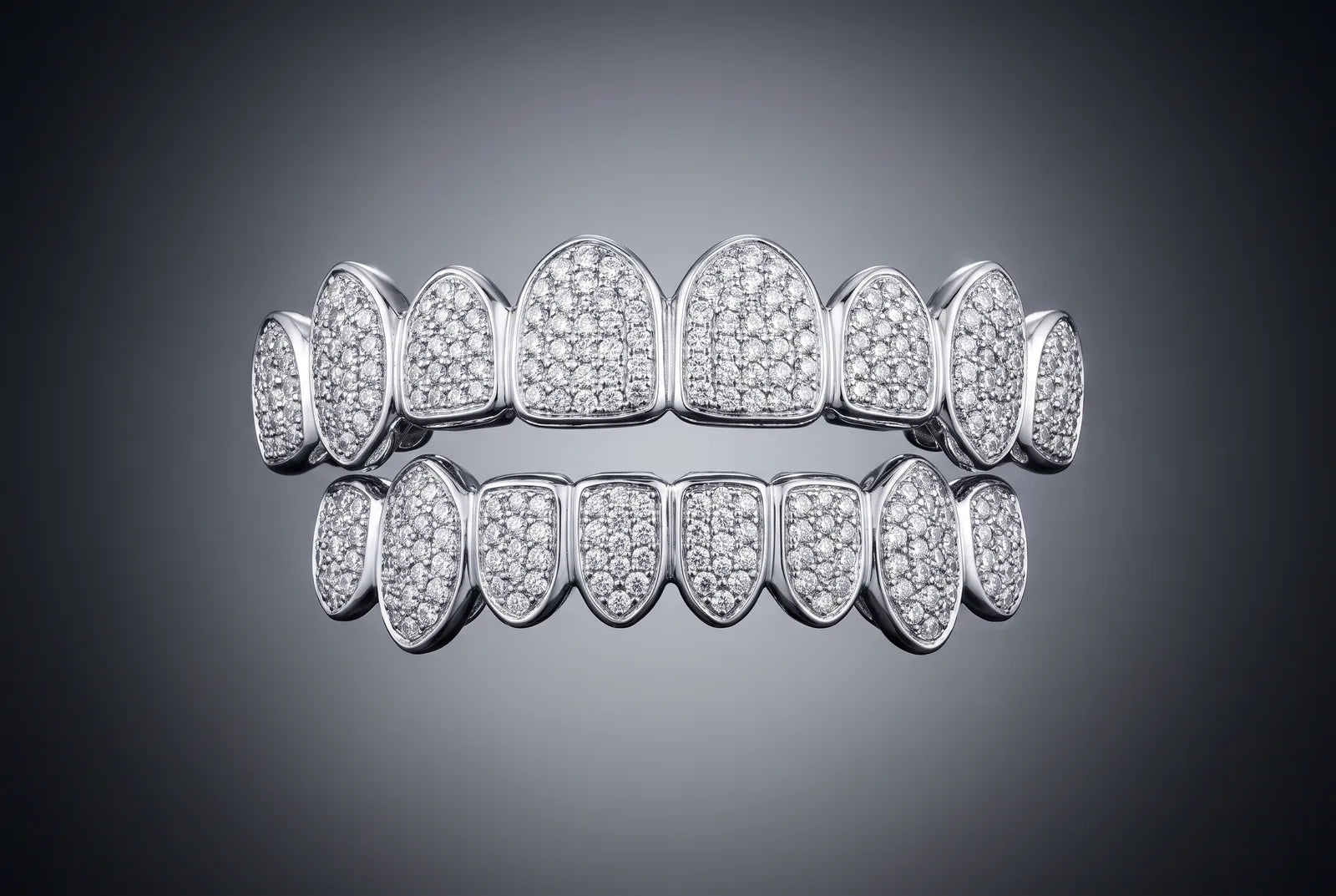 A full custom iced-out 925 silver grill, top and bottom, revealed
